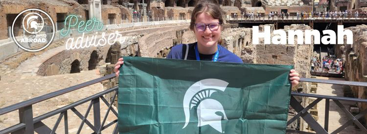 Photo of Hannah Kilbride holding Spartan flag inside Colesium in Rome, Italy