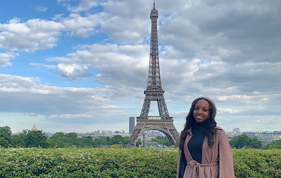 Student in front of Eiffel Tower in Paris, France