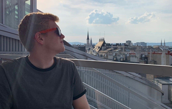 Student looking over cityscape in Germany