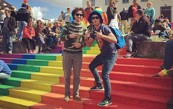 Two students standing on rainbow colored stairs in Netherlands