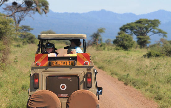 Students riding in Jeep in Kenya