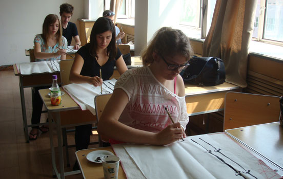 Students doing Chinese calligraphy